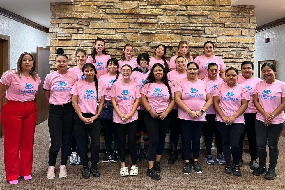 The Touch of Europe team in pink Cleaning for a Reason shirts